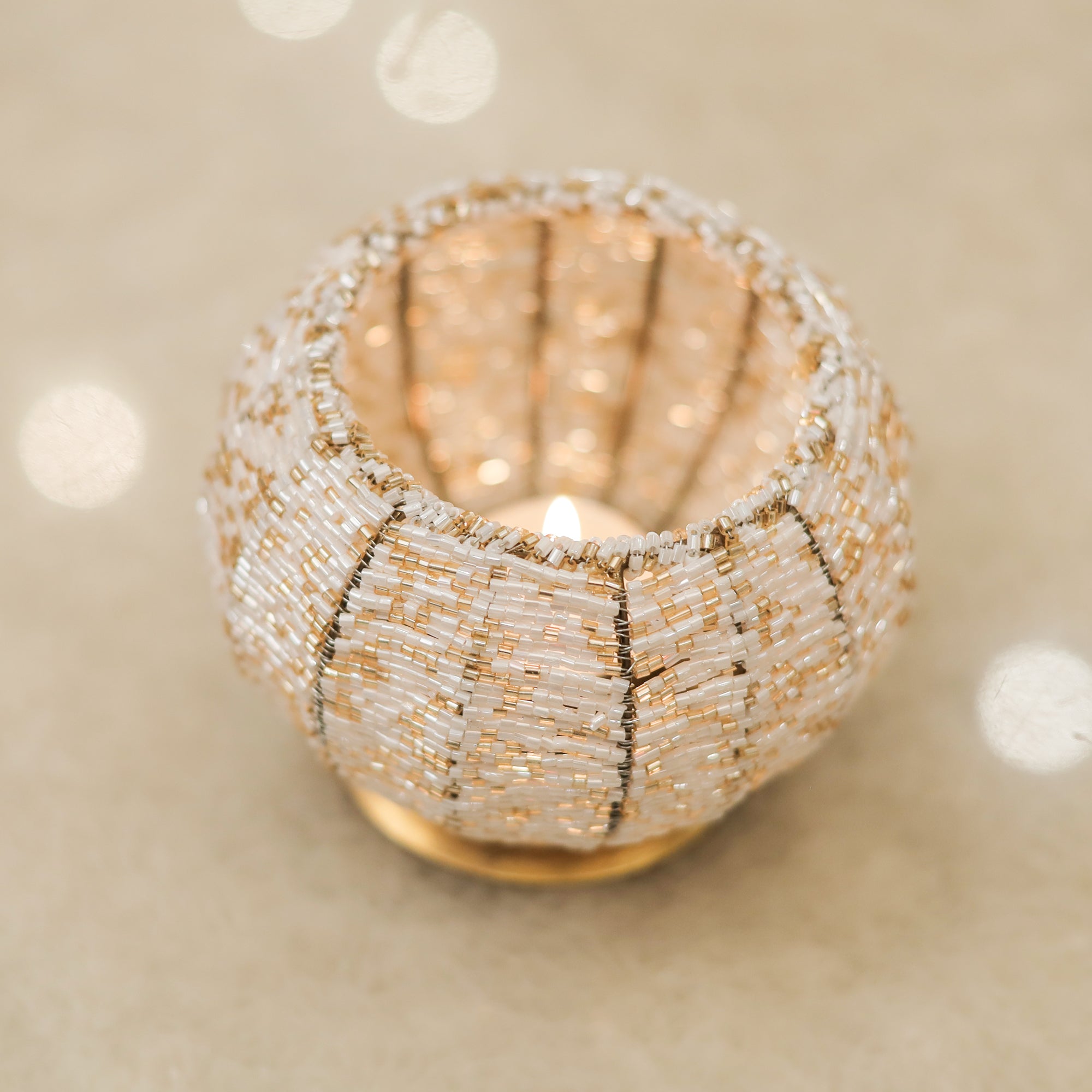 Timeless Metal Beaded T-Light Holder for Warm, Inviting Light