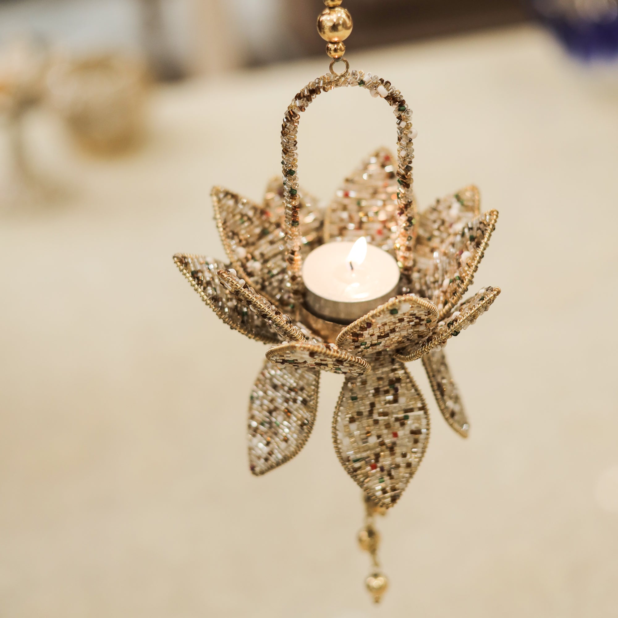 Ornate Metal Beaded T-Light Stand for Perfect Candlelight