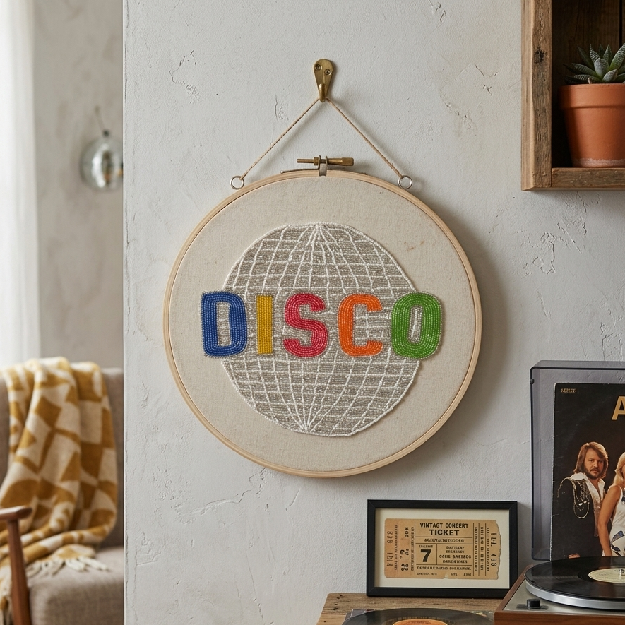  Decorative hoop with 'DISCO' text in a living room setting with vinyl records and a plant. 