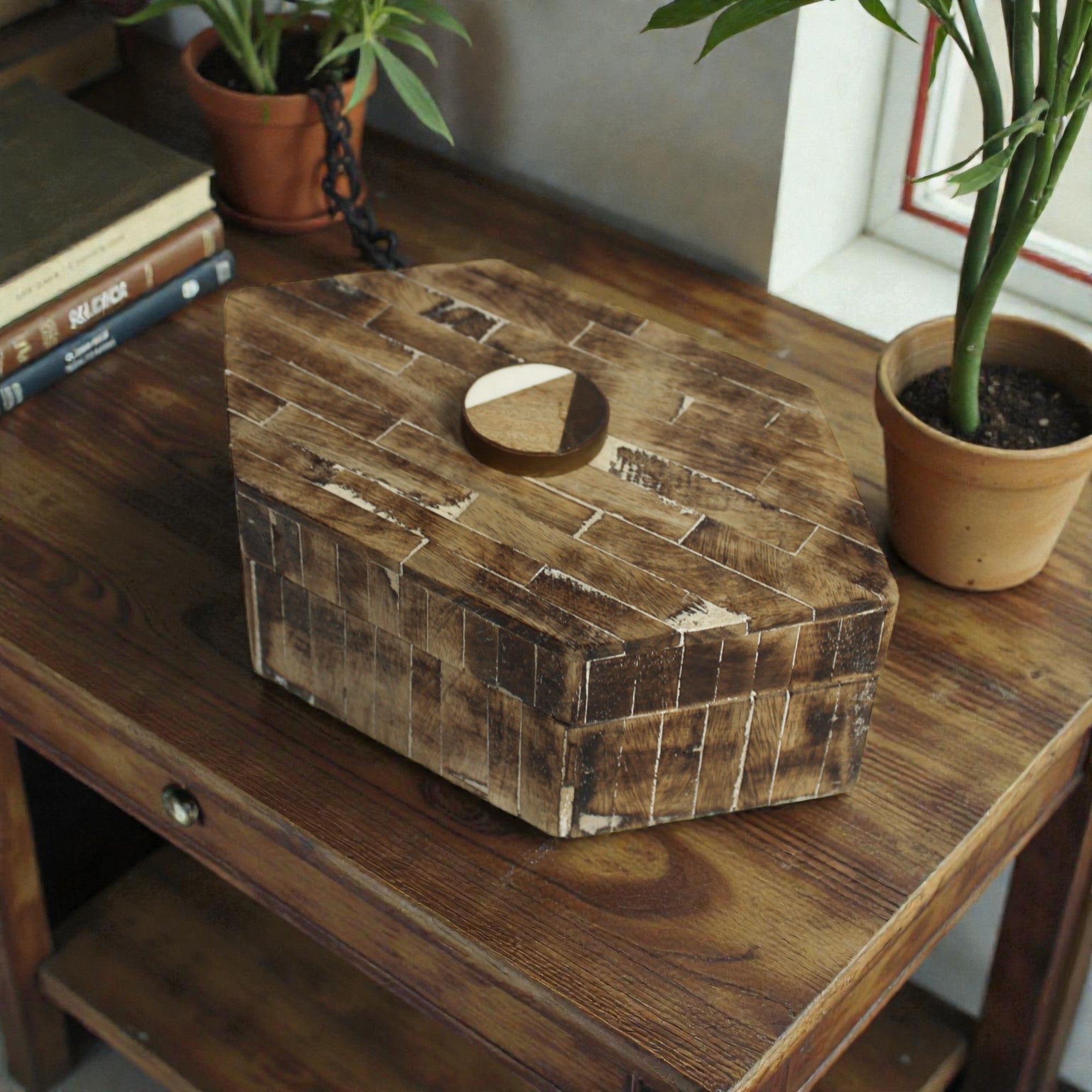  Wooden box on a wooden surface with plants in the background 